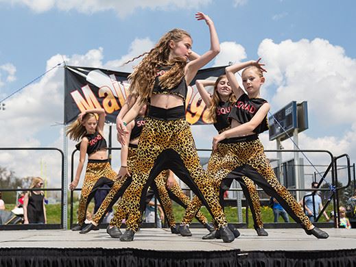 Girls dance team performing on stage